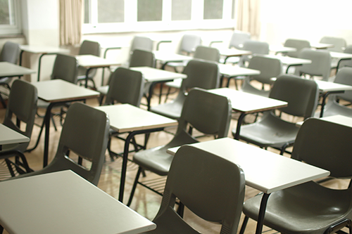 Empty elementary classroom with desks